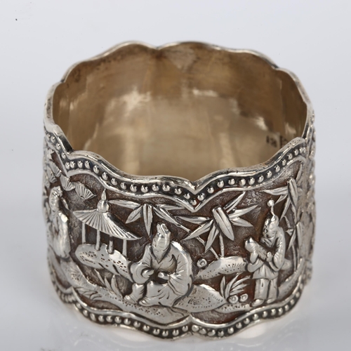 1399 - A Chinese export cast-silver napkin ring, relief village scene decoration, by Wang Hing, circa 1900,... 