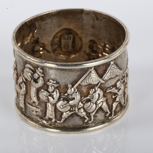 1400 - A Chinese export silver napkin ring, musical procession decoration, by Tuck Chang, circa 1900, diame... 