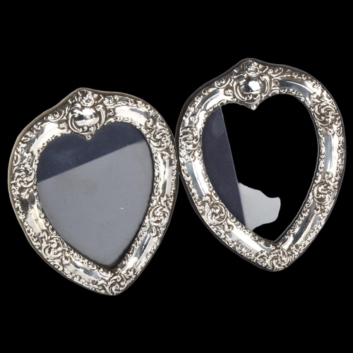 1407 - A pair of Elizabeth II silver heart photo frames, relief embossed foliate decoration, maker's marks ... 