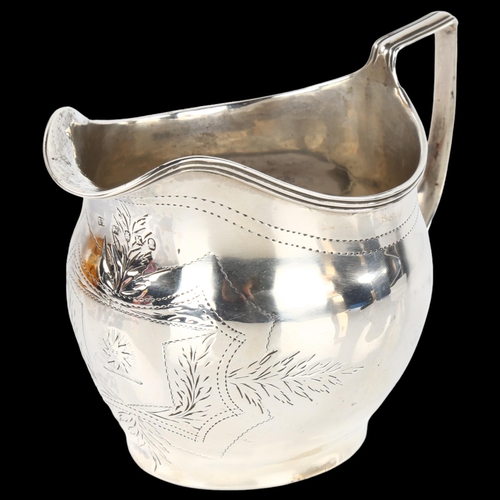 1413 - A George III silver helmet cream jug, with bright-cut engraved decoration and reeded rim, probably b... 