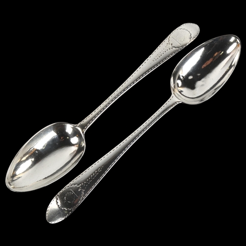 1415 - A pair of George III Irish silver serving spoons, with bright-cut engraved decoration, by John Pitta... 