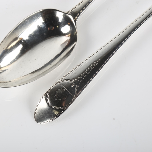 1415 - A pair of George III Irish silver serving spoons, with bright-cut engraved decoration, by John Pitta... 