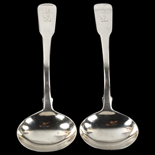 1417 - A pair of George III silver Fiddle pattern sauce ladles, with engraved Bishop's armorial crest, by T... 