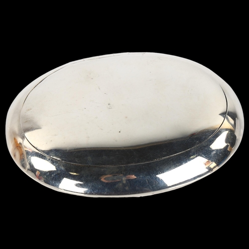 1418 - A George V Art Deco silver tobacco box, oval plain form with squeeze spring lid, by George Unite, ha... 