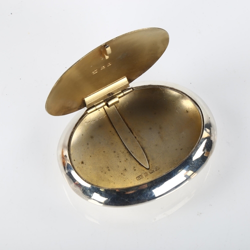 1418 - A George V Art Deco silver tobacco box, oval plain form with squeeze spring lid, by George Unite, ha... 