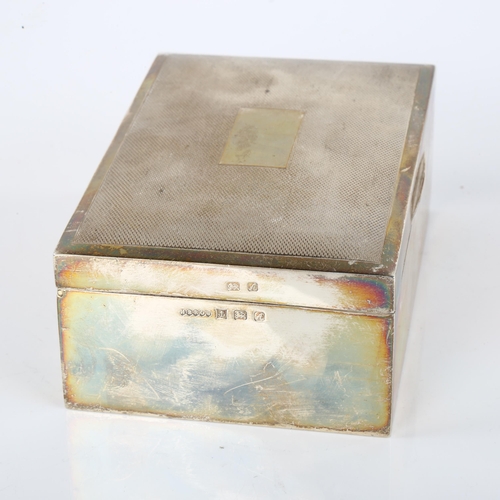 1420 - An Elizabeth II silver cigarette box, with engine turned lid, by Harman Brothers, hallmarks Birmingh... 