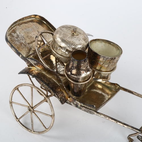 1422 - A Chinese white metal rickshaw cruet set, circa 1920, length 20cm (1 wheel detached)