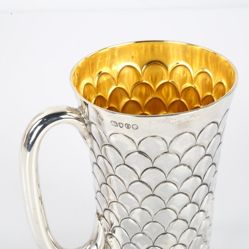 1423 - A Victorian silver mug, tapered cylindrical form with scale decoration and gilt interior, by Martin,... 