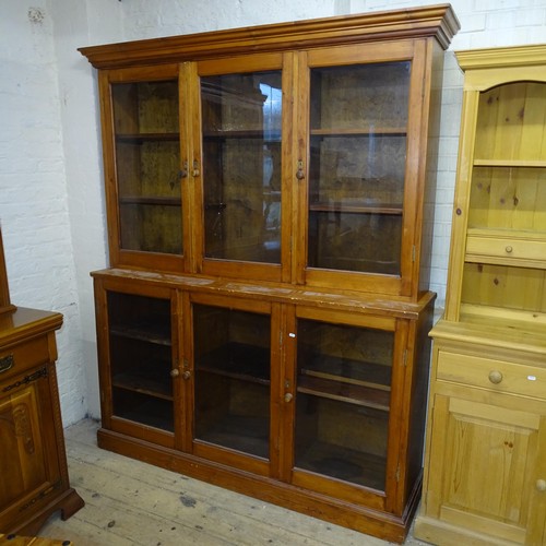 2091 - An antique stained pine two section bookcase with six glazed doors. 170x214x45cm