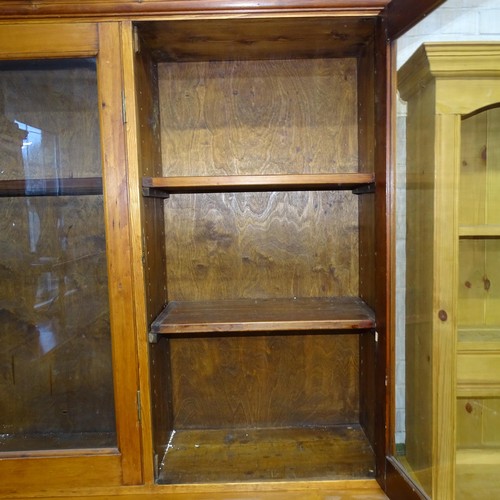 2091 - An antique stained pine two section bookcase with six glazed doors. 170x214x45cm