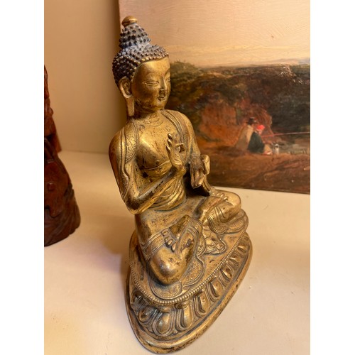 211 - A Chinese gilt-bronze seated Buddha, height 15cm