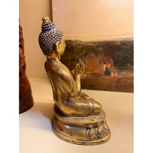 211 - A Chinese gilt-bronze seated Buddha, height 15cm