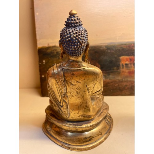 211 - A Chinese gilt-bronze seated Buddha, height 15cm