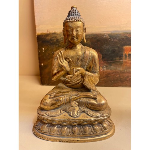 211 - A Chinese gilt-bronze seated Buddha, height 15cm