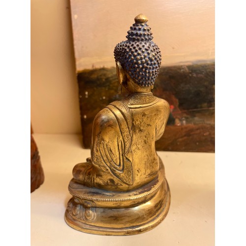 211 - A Chinese gilt-bronze seated Buddha, height 15cm