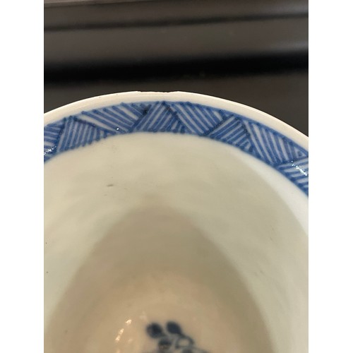 223 - A Chinese blue and white porcelain cup, with painted floral panels and 6 character mark, height 8cm,... 