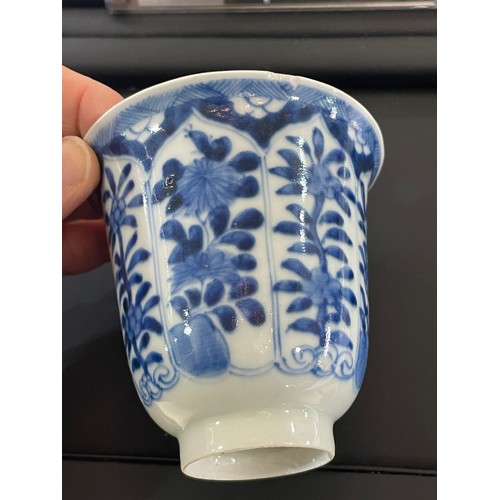 223 - A Chinese blue and white porcelain cup, with painted floral panels and 6 character mark, height 8cm,... 