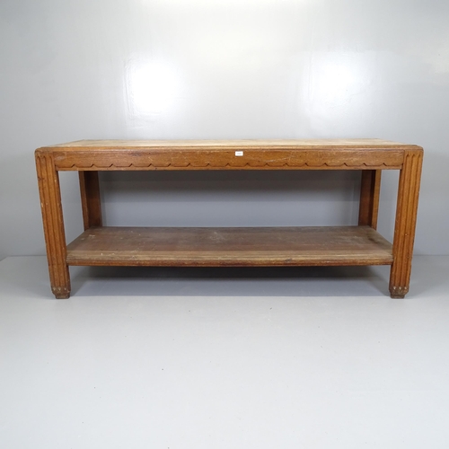 2518 - An Art Deco oak centre-standing 2-tier draper's table, with applied carved frieze, 200 x 86 x 70cm