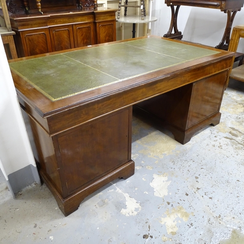 2527 - An antique mahogany twin pedestal partner's writing desk, with tooled and embossed green leather ski... 