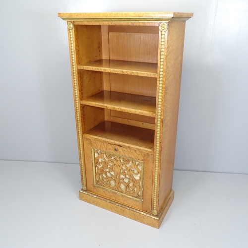 2528 - A 1930s burr walnut veneered bookcase, with two adjustable shelves and cupboard under. 70x138x40cm