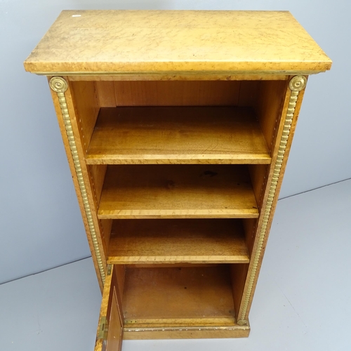 2528 - A 1930s burr walnut veneered bookcase, with two adjustable shelves and cupboard under. 70x138x40cm