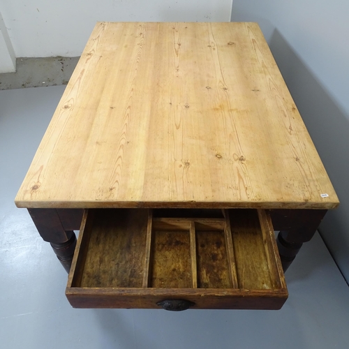 2549 - An antique pine scrub-top farmhouse kitchen table, with end frieze drawers and raised on turned legs... 