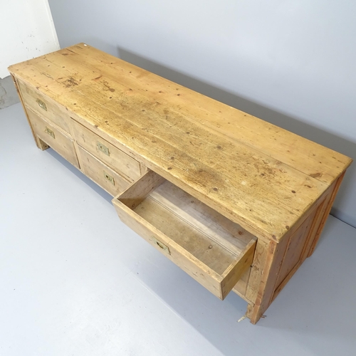 2558 - A vintage pine bank of six drawers. 199x62x58cm