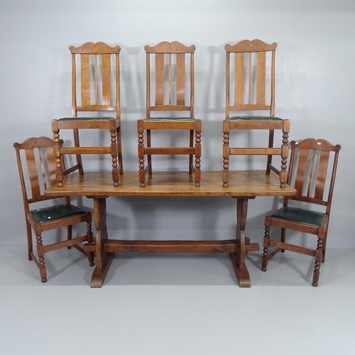 2054 - An antique oak refectory dining table, 169x76x72cm, and a set of five oak dining chairs with faux le... 