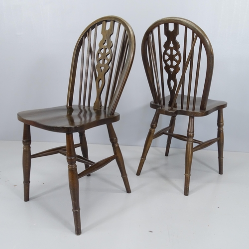 2060 - A set of six elm-seated wheelback dining chairs.