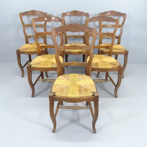 2061 - A set of six French rush seated ladder back dining chairs