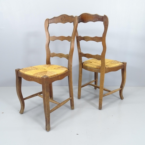 2061 - A set of six French rush seated ladder back dining chairs