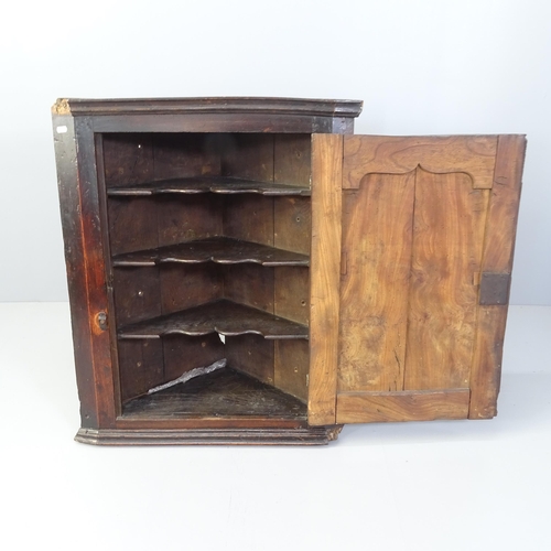 2062 - A Georgian mahogany corner cupboard with single panelled door. 77x88x37cm