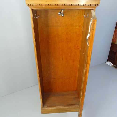 2066 - An early 20th century Walnut panel fronted wardrobe with single hanging rail. 68 x 158 x 34cm.