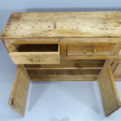 2073 - An antique pine sideboard with five frieze drawers and cupboards under. 215x79x46cm