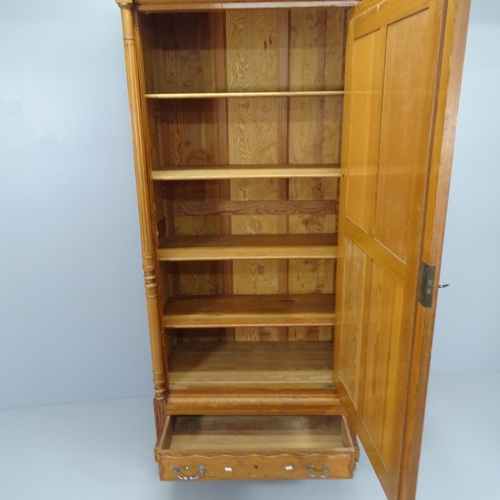 2076 - A French pitch pine armoire with single mirrored door, shelf fitted interior and single drawer under... 