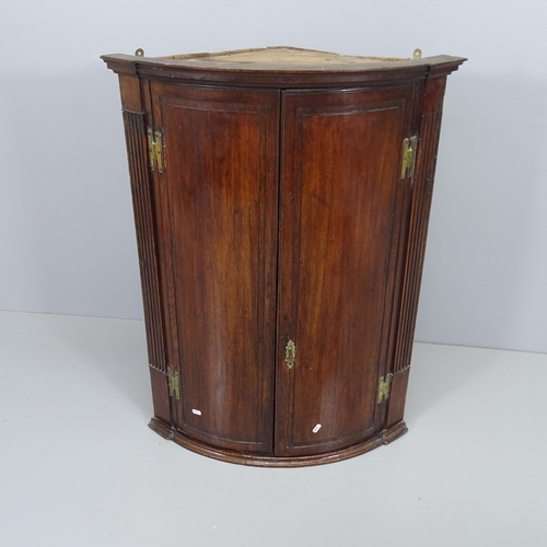 2081 - A 19th century mahogany hanging corner cupboard. 72x96x48cm