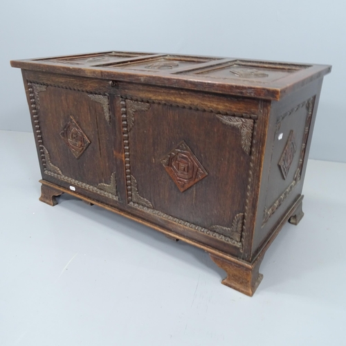 2085 - A late 19th century panelled oak coffer, with carved  decoration. 84x50x46cm