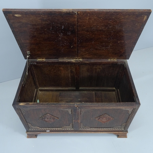 2085 - A late 19th century panelled oak coffer, with carved  decoration. 84x50x46cm