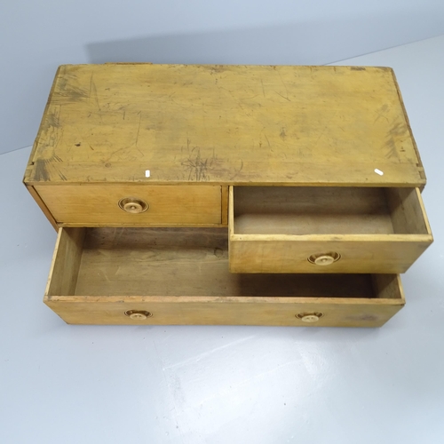 2086 - A vintage pine campaign style low chest of two short and one long drawer. 122x55x55cm