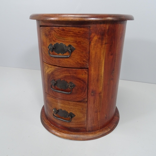 2090 - A modern teak circular drum chest of three drawers. 40x47cm