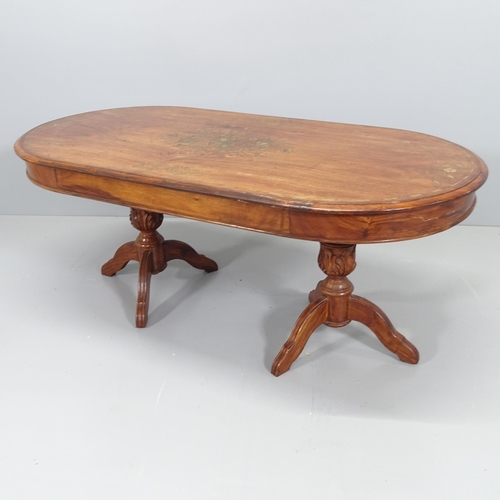 2102 - An Anglo-Indian mahogany and brass-inlaid oval coffee table. 123x49x60cm