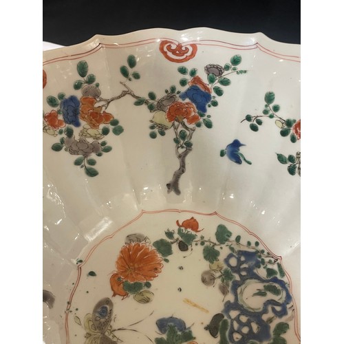 221 - A Chinese white glaze porcelain lotus flower design bowl, with painted butterflies and flowers, diam... 