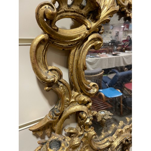 163 - A Rococo style girandole, probably late 19th century, giltwood and gesso with 3 candle brackets, sur... 