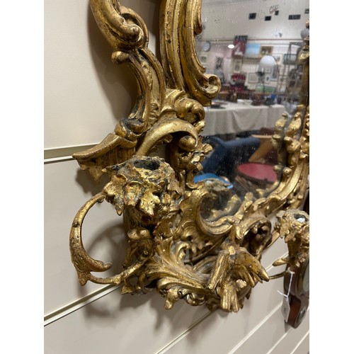163 - A Rococo style girandole, probably late 19th century, giltwood and gesso with 3 candle brackets, sur... 