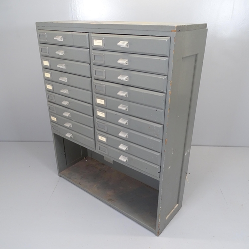 2577 - A vintage painted pine bank of 18 fall-front drawers with shelf under. 93x114x35cm