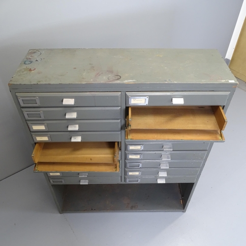 2577 - A vintage painted pine bank of 18 fall-front drawers with shelf under. 93x114x35cm