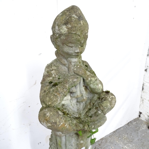 2589 - A weathered concrete garden statue, study of a meditating boy. Height 90cm.