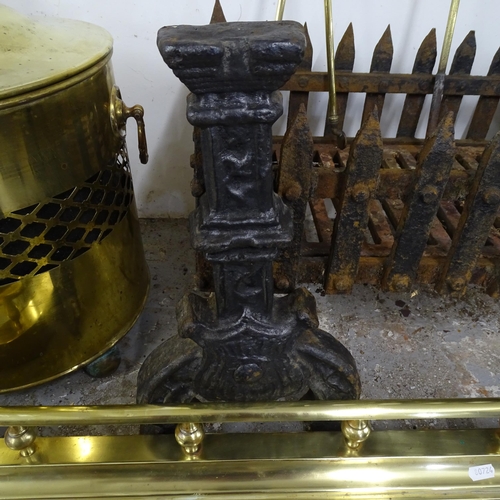 2591 - A cast iron ducks nest fire grate, W 140cm, two fire dogs, a brass companion set, fire surround and ... 