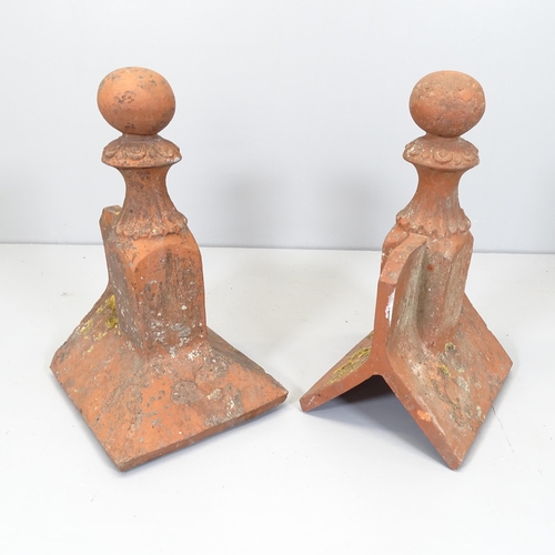 2596 - Two terracotta roof finials. Height 54cm.