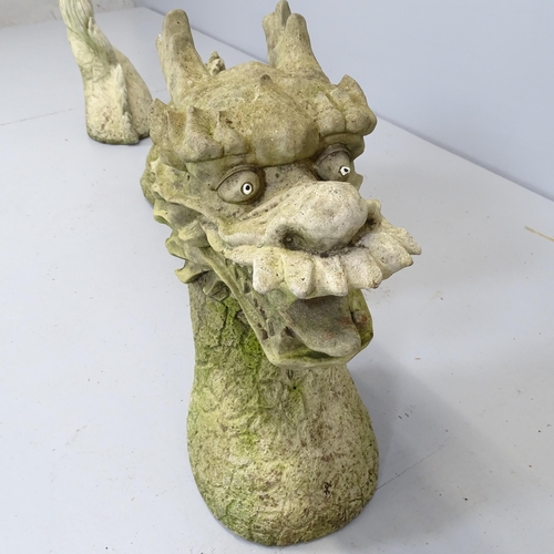 2602 - A three-section weathered concrete garden Chinese Sea Dragon ornament. Head height 44cm.